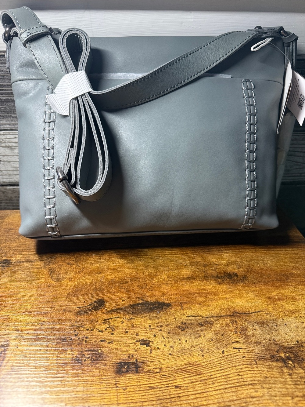 The Sak Gray Leather Crossbody Bag with Whipstitch Detail